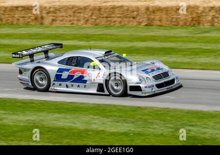 Mercedes Benz CLK GTR racing car driving up the hill climb track at the Goodwood Festival of Speed motor racing event 2014. Produced by AMG for GT1 Stock Photo