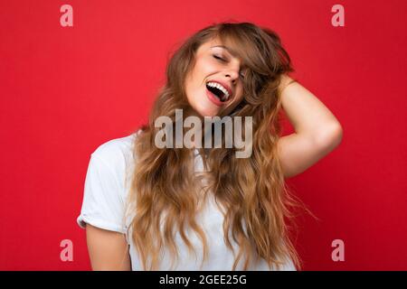 Close-up portrait of nice-looking attractive lovely lovable pretty cute winsome gorgeous cheerful cheery wavy-haired blonde woman isolated on pastel Stock Photo
