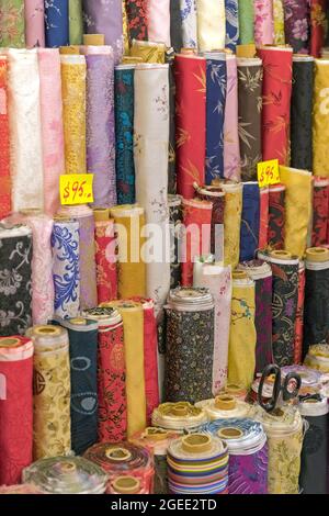 Colourful Textile Material in Rolls at Wholesaler Stock Photo