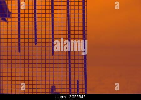 Duocolor image of a pattern made off iron objects, seen outdoors. Stock Photo