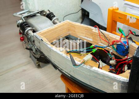 disassembled electric scooter pulled out battery Stock Photo