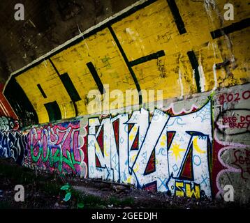 street art in tunnel that fallows a train track in nova scotia Stock Photo