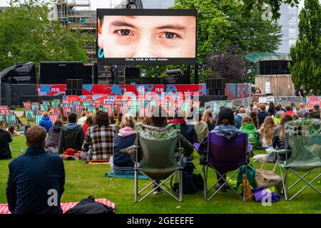 Edinburgh, Scotland, UK. 19th August  2021. Audience watch an outdoor screening of the cult movie Ferris Bueller’s Day Off at the  Film Fest in the City outdoor cinema in St Andrew Square. This is one of the events taking place during the Edinburgh International Film Festival in the city.  Iain Masterton/Alamy Live news. Stock Photo