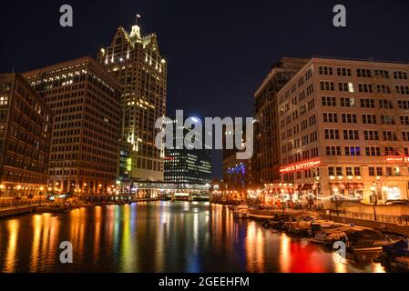 Night view of Milwaukee RiverWalk, a pedestrian pathway that meanders along the Milwaukee River, adjacent to restaurants, shopping, Milwaukee, WI, USA Stock Photo