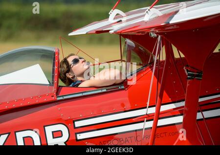Female pilot Lauren Richardson preparing to display her Pitts Special aerobatic plane at an airshow. Married name Lauren Wilson. Young lady Stock Photo