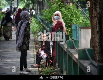 New Delhi, India. 19th Aug, 2021. NEW DELHI, INDIA - AUGUST 19: Afghan nationals wait to deposit documents for resettlement, outside the Australian embassy, at Shantipath on August 19, 2021 in New Delhi, India. Australia has recently said it will over a year offer humanitarian visas to 3000 persons specifically for those now fleeing Afghanistan. (Photo by Sanchit Khanna/Hindustan Times/Sipa USA) Credit: Sipa USA/Alamy Live News Stock Photo