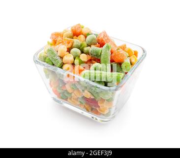 Bowl with mix of frozen vegetables on white background Stock Photo