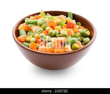 Bowl with mix of frozen vegetables on white background Stock Photo