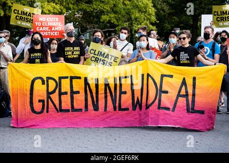 New York, United States. 19th Aug, 2021. Participants hold a banner that says Green New Deal during the Seal the Deal rally organized by the Green New Deal Network to advocate for Green New Deal related legislation in current infrastructure and budget reconciliation legislation in Congress. Credit: SOPA Images Limited/Alamy Live News Stock Photo