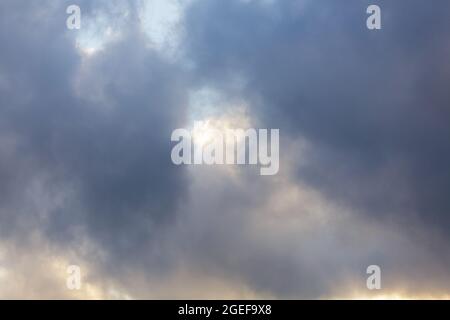 The background consists of large gray clouds in sky before heavy rain. Natural background. Weather forecast concept. Stock Photo