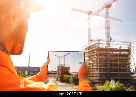 OSHA Inspection Worker At Construction Site Taking Photo Stock Photo