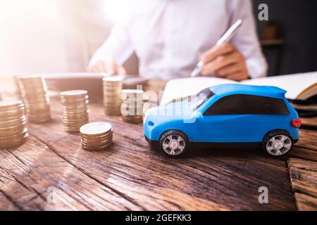 Calculating Car Finance And Loan Documents. Checking Budget Stock Photo