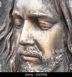 Face of jesus. Ancient sculpture. Bronze statue of the face of jesus. Ideal for concepts or events like Easter. Stock Photo