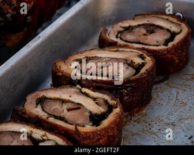 sliced roast pork roll in a metal tray Stock Photo