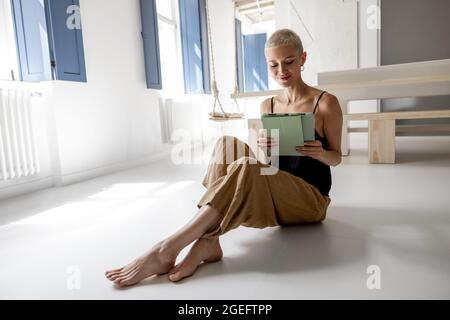 Stylish woman with a digital tablet at modern apartment Stock Photo