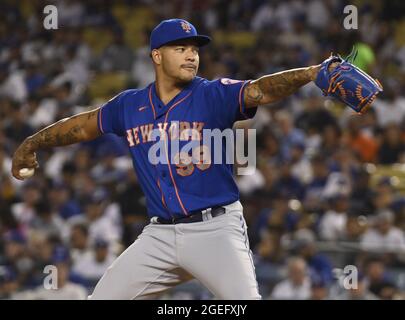 Los Angeles, USA. 20th Aug, 2021. New York Mets' starting pitcher Taijuan Walker winds up to deliver during the second inning at Dodger Stadium in Los Angeles on Thursday, August 19, 2021. The Dodgers used a bullpen game to defeat the Mets 4-1 for their seventh in a row. Photo by Jim Ruymen/UPI Credit: UPI/Alamy Live News Stock Photo