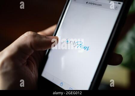 Bangkok, Thailand - August 20, 2021 :A mobile user browsing Only Fans website. Stock Photo