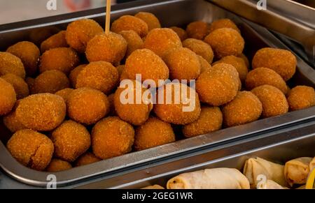 many Ascoli olives in a metal container Stock Photo
