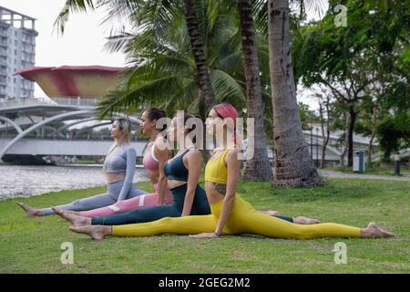 Stretching workout. A group of young girls in black uniforms are