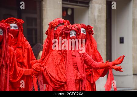 London, United Kingdom. 3rd April 2021. Extinction Rebellion's Red Rebel Brigade at the Kill The Bill protest in Mayfair. Stock Photo