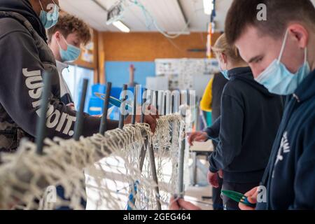 Technical college “Lycee Pierre Loti” in Paimpol (Brittany, north western France): mending of fishing nets and marlinespike seamanship, high school st Stock Photo