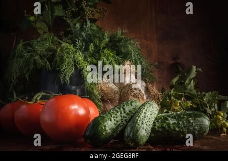 ripe vegetables on a dark wooden background in a rustic style Stock Photo