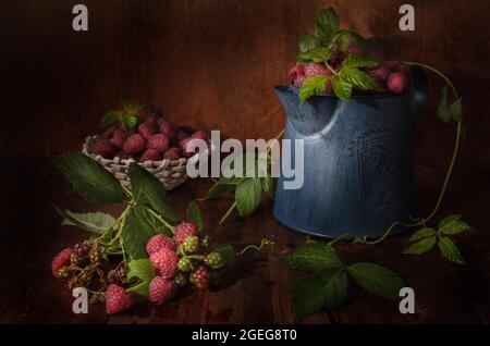 ripe raspberries on a dark wooden background in a rustic style Stock Photo