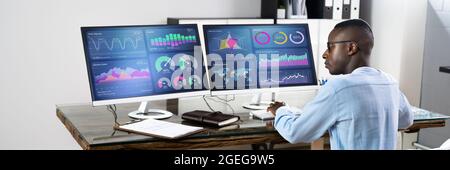 African Advisor Using KPI Dashboard With Financial Analytics Graphs Stock Photo