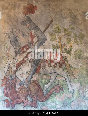The restored medieval wall painting of St. George slaying the dragon, St. Gregory's Church, Bedale, North Yorkshire, England, UK Stock Photo