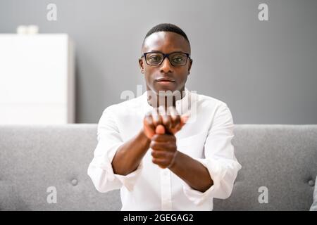 Young African Man Using Sign Language. Online Learning Call Stock Photo