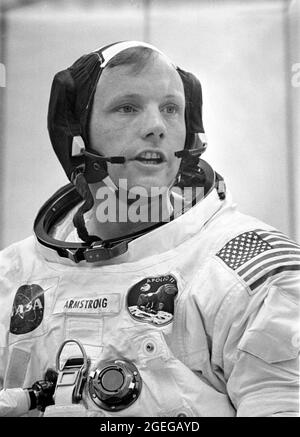 Dunned in his space suit, mission commander Neil A. Armstrong does a final check of his communications system before before the boarding of the Apollo 11 mission. Launched via a Saturn V launch vehicle, the first manned lunar mission launched from the Kennedy Space Center, Florida on July 16, 1969 and safely returned to Earth on July 24, 1969. The Saturn V vehicle was developed by the Marshall Space Flight Center (MSFC) under the direction of Dr. Wernher von Braun. The 3-man crew aboard the flight consisted of astronauts Armstrong; Michael Collins, Command Module (CM) pilot; and Edwin E. Aldri