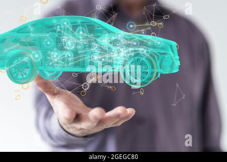 Male's hands holding an illustration of autonomous online car-sharing service controlled Stock Photo