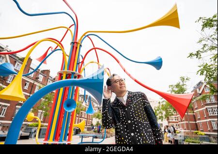 Artist Yuri Suzuki with his sculpture Sonic Bloom at Brown Hart Gardens in Mayfair, London. Picture date: Friday August 20, 2021. Stock Photo