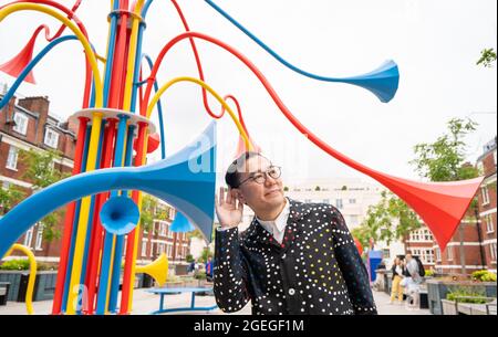 Artist Yuri Suzuki with his sculpture Sonic Bloom at Brown Hart Gardens in Mayfair, London. Picture date: Friday August 20, 2021. Stock Photo