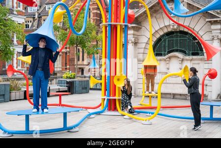 Artist Yuri Suzuki with his sculpture Sonic Bloom at Brown Hart Gardens in Mayfair, London. Picture date: Friday August 20, 2021. Stock Photo