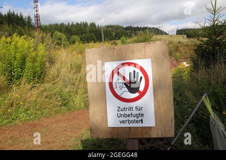 Georgenthal, Germany. 20th Aug, 2021. 'No entry for unauthorized persons' is written on the edge of excavations at the Bromacker fossil deposit between Tambach-Dietharz and Georgenthal. During this year's excavations at the globally significant fossil deposit in the Thuringian Forest, researchers have secured a huge amount of finds. Credit: Martin Wichmann/dpa-Zentralbild/dpa/Alamy Live News Stock Photo