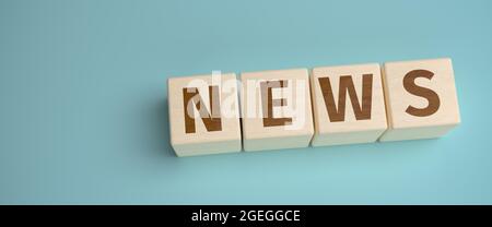 'News' web banner - the word 'News' built from letters on wooden cubes for the use as a web banner. Stock Photo