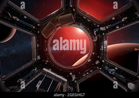 View from a porthole of space station on the Mars background. Elements of this image furnished by NASA. Stock Photo