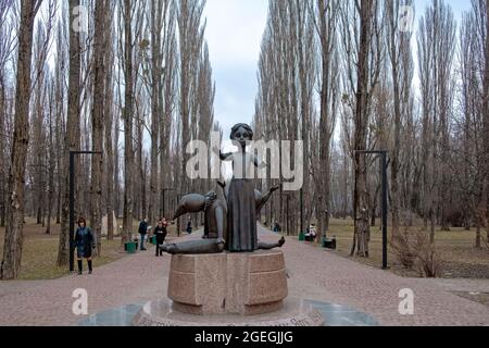 Babyn Yar Park Leading Lines Tree Alley with Monument of Jewish People Killed During World War II Stock Photo