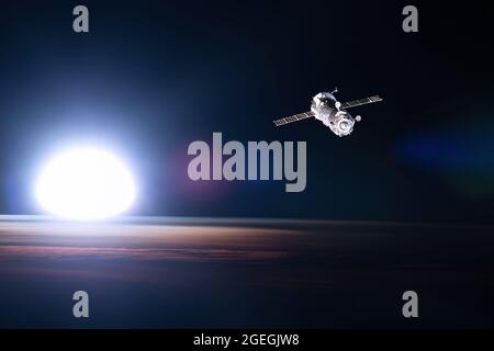 View from a porthole of space station on the Earth background. Elements of this image furnished by NASA. Stock Photo