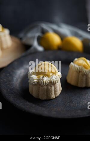 mini lemon bundt cakes topped with lemon Stock Photo