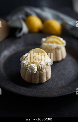 mini lemon bundt cakes topped with lemon Stock Photo