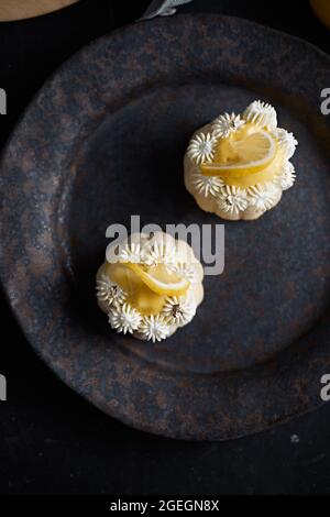 mini lemon bundt cakes topped with lemon Stock Photo