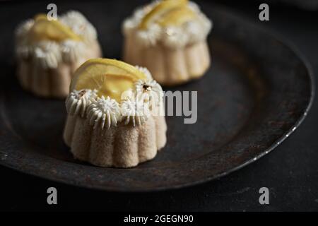 mini lemon bundt cakes topped with lemon Stock Photo