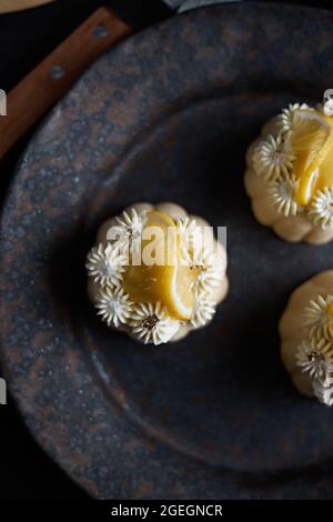 mini lemon bundt cakes topped with lemon Stock Photo