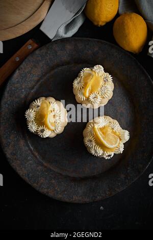 mini lemon bundt cakes topped with lemon Stock Photo