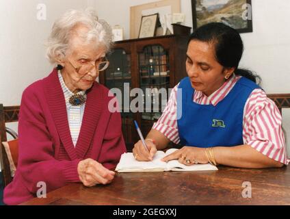 Carer and elderly woman, UK Stock Photo