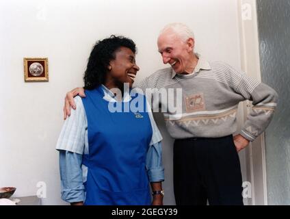 Carer and elderly man UK Stock Photo