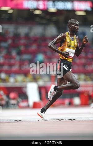 Joshua Cheptegei running in the 5000 meters of the Tokyo 2020 Olympic Games. Stock Photo