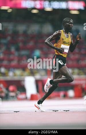 Joshua Cheptegei running in the 5000 meters of the Tokyo 2020 Olympic Games. Stock Photo